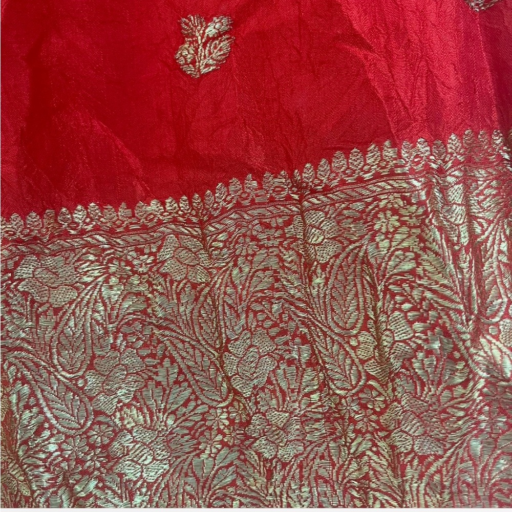 Red and gold silk scarf with floral detailing. Dry clean only. 58’x 19’